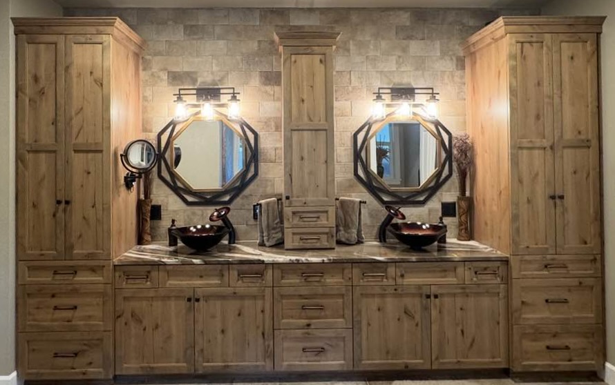 Master Double Vanity with stone countertop and new cabinetry, lighting sinks, faucets an mirrors.